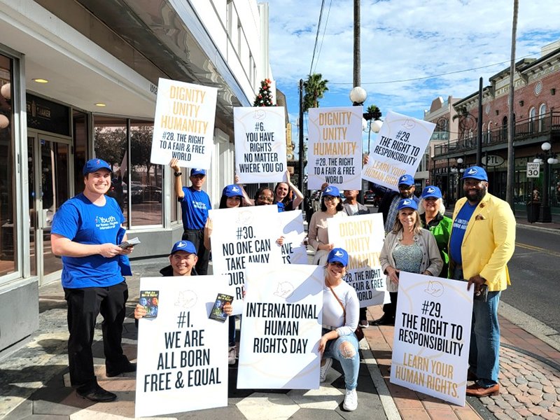 Christopher King, President of United for Human Rights Florida and Founder of The Gentleman’s Course leads a human rights awareness march on International Human Rights Day in December 2023